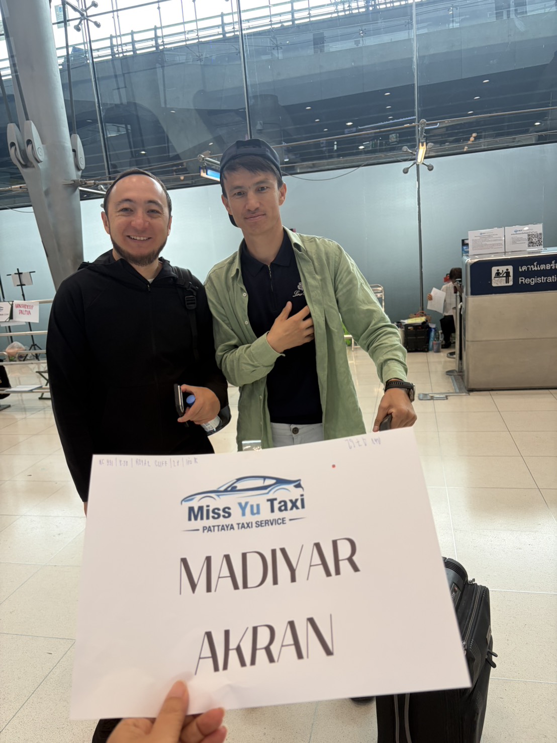 Miss Yu Taxi customer pickup at airport arrivals